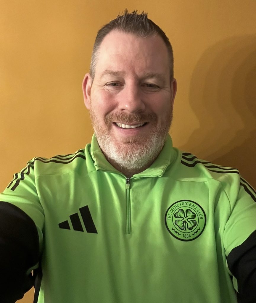 Celtic Neon green long sleeve training top from season 2025 2026 season